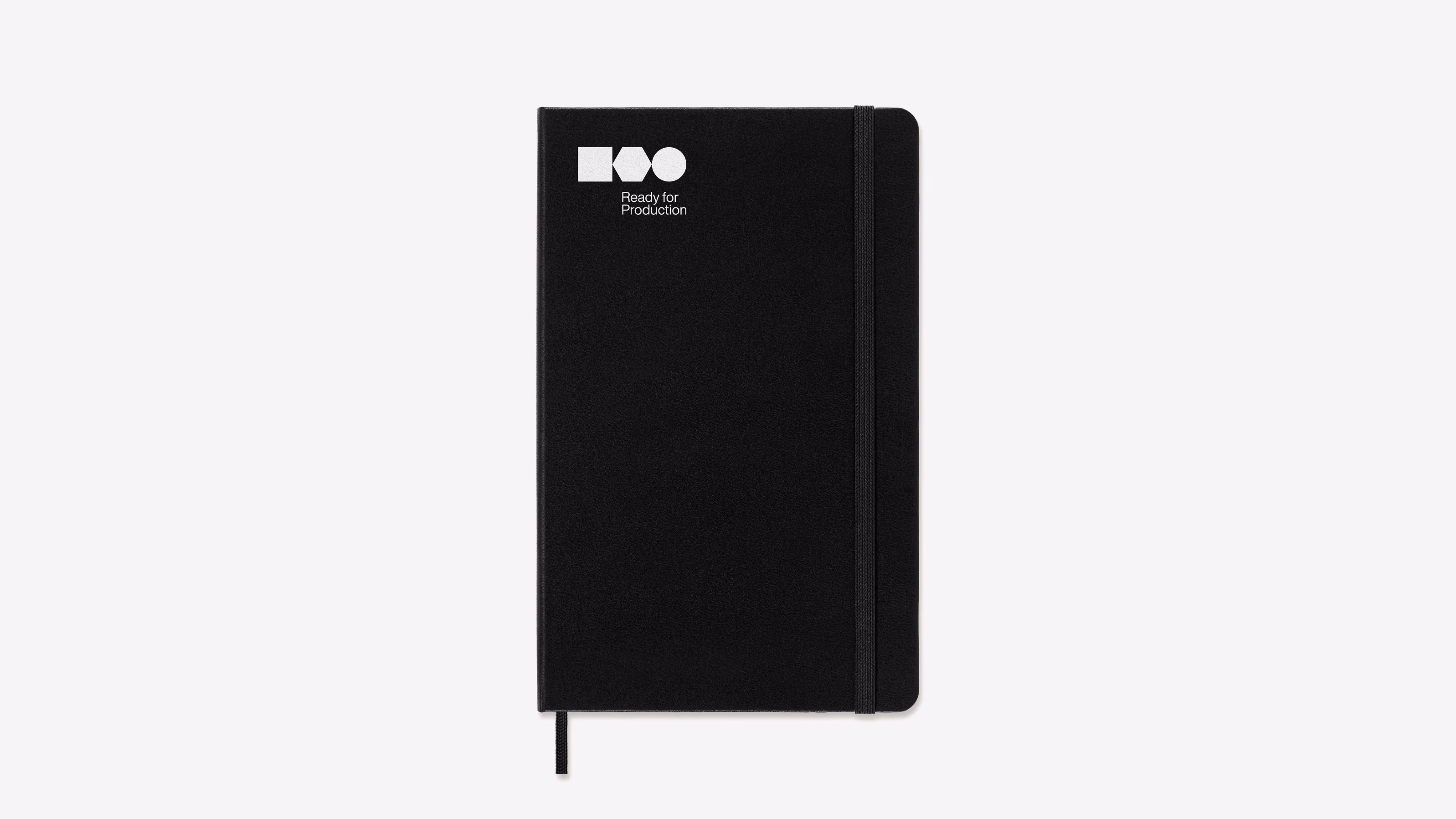 Ready for Production — Mockup de caderno preto com logo e wordmark